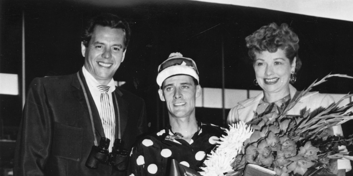 Lucille Ball and Desi Arnaz at Del Mar racetrack with jockey during Hollywood’s golden era