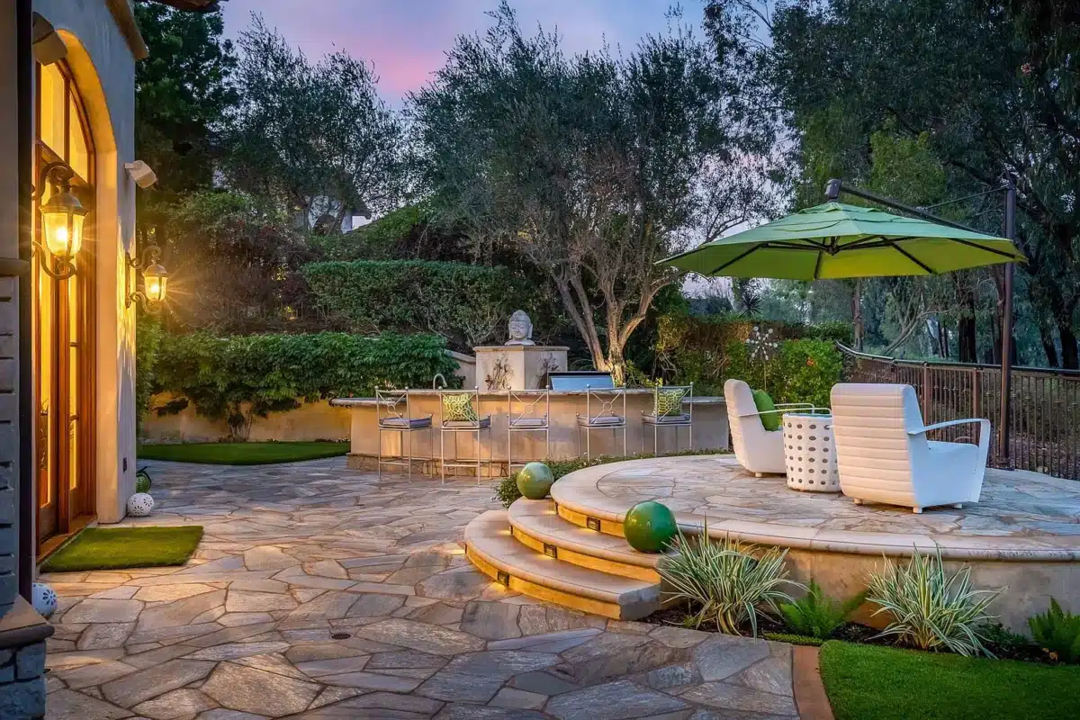 Outdoor Entertaining at The Bridges Outdoor entertaining space with seating and bar area at a luxury home in The Bridges Rancho Santa Fe