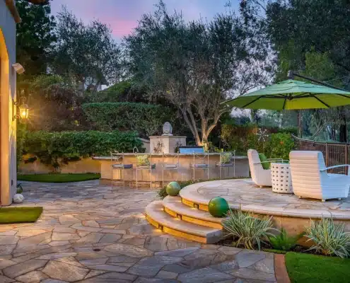 Outdoor Entertaining at The Bridges Outdoor entertaining space with seating and bar area at a luxury home in The Bridges Rancho Santa Fe